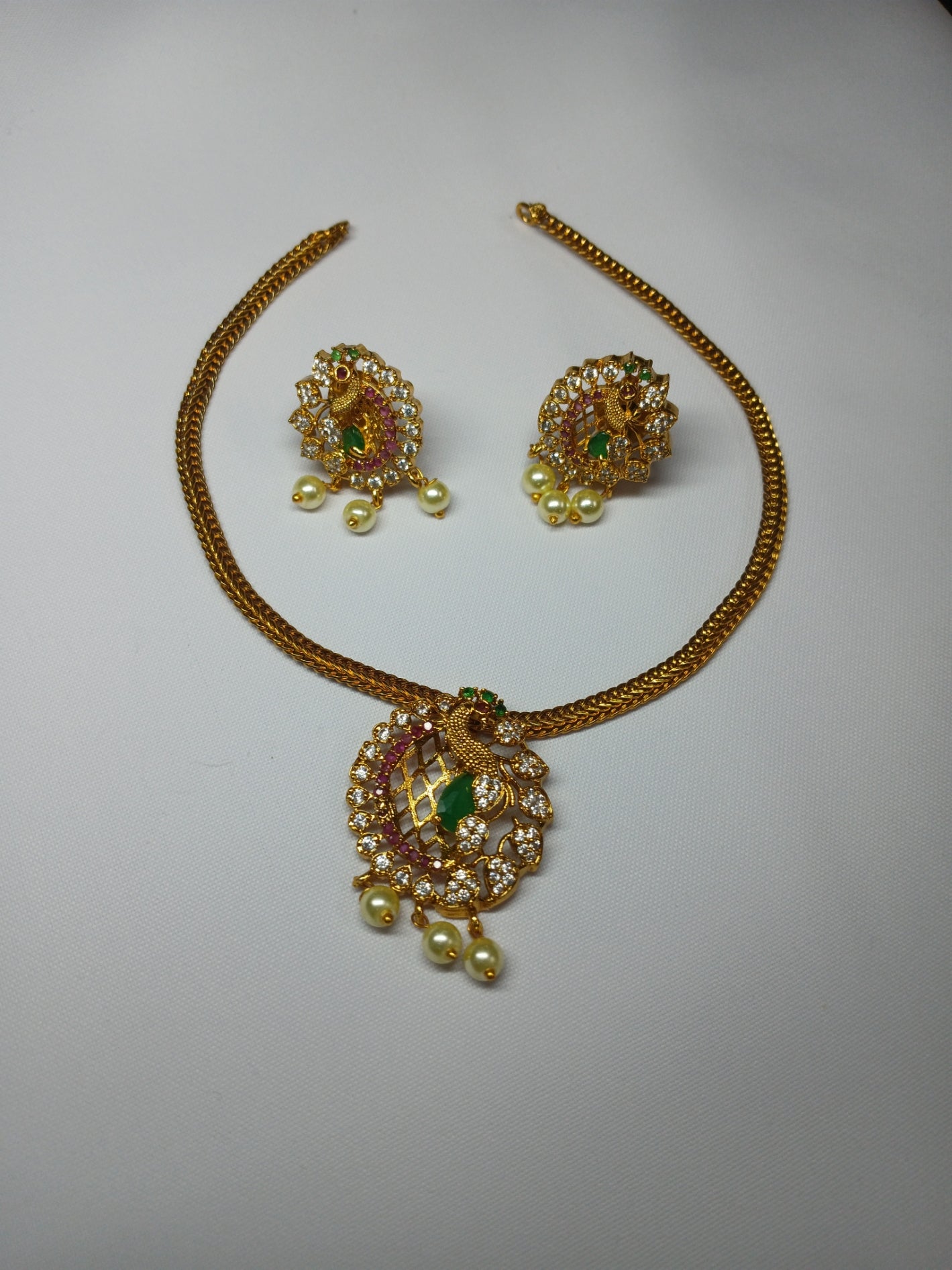 Khan's Collections Matte Necklace Set With AD Stone and Pearls in Peacock design